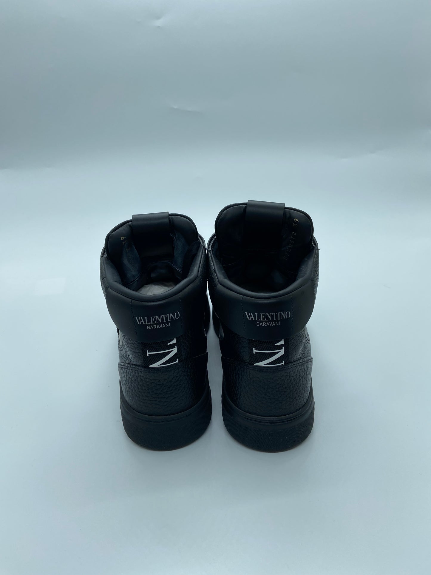 Valentino Garavan high top shoes with black background